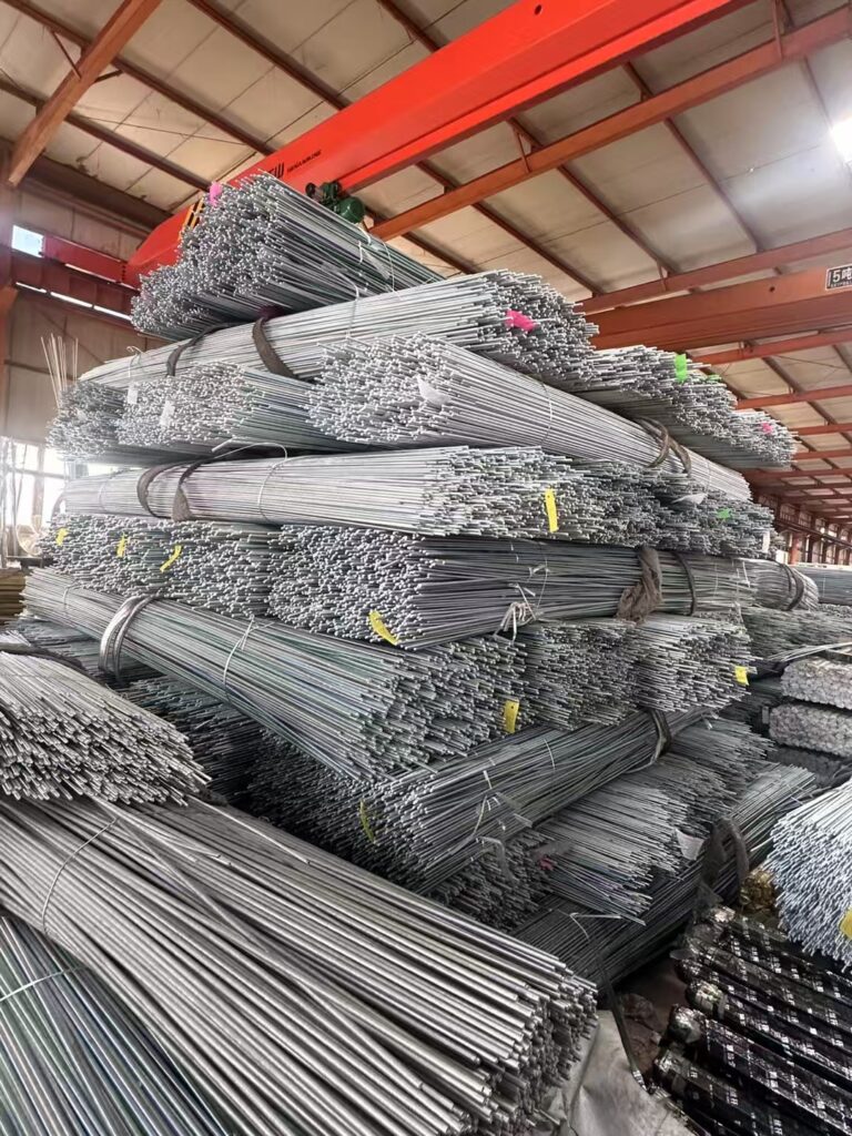 Freshly electro galvanized threaded rods after zinc plating before export packaging at Shenhui Fasteners factory